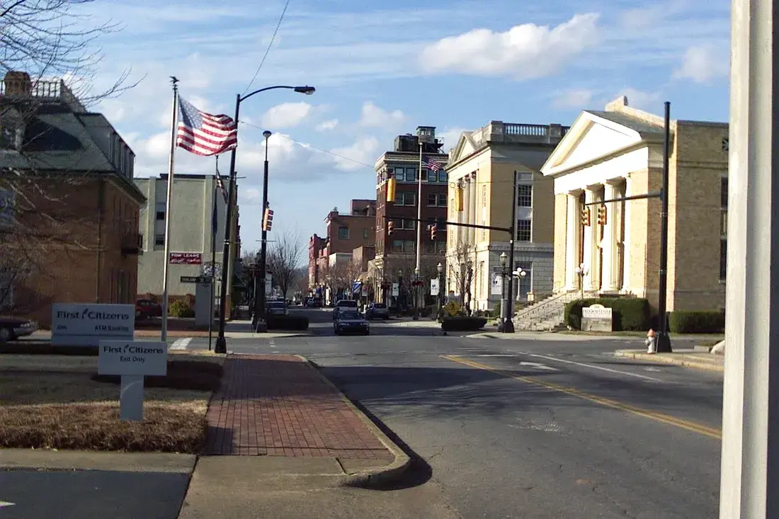 Columned civic buildings and an American flag in downtown Rock Hill, SC