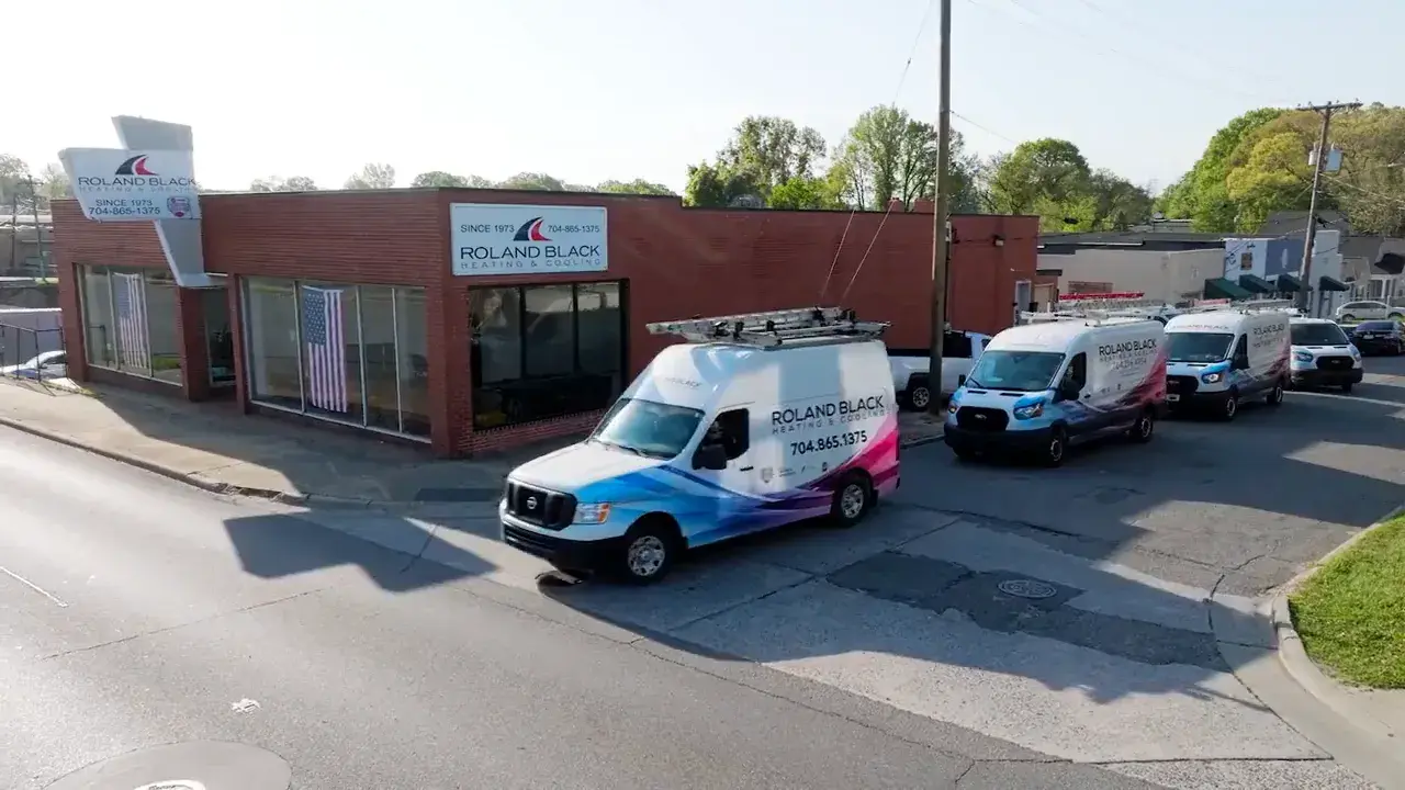 Roland Black service vans outside the Gastonia, NC shop on E Franklin Blvd