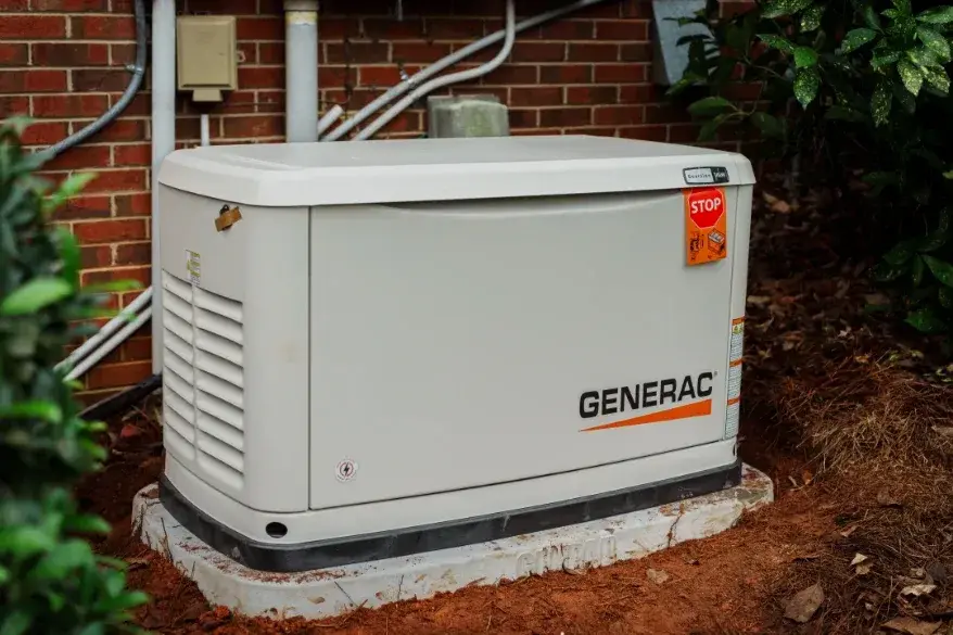 Generac standby generator installed on a concrete pad beside a home in Gastonia, NC