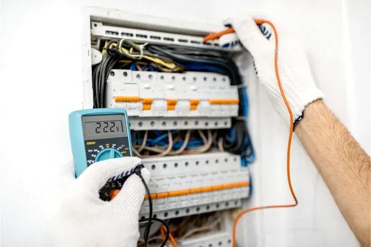 Electrician checking a newly installed breaker panel in Gastonia, NC