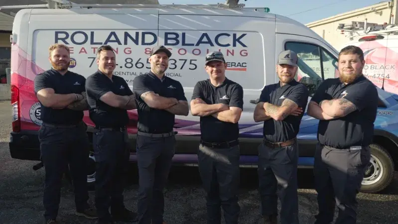 Roland Black technicians standing in front of a company van in Gastonia, NC
