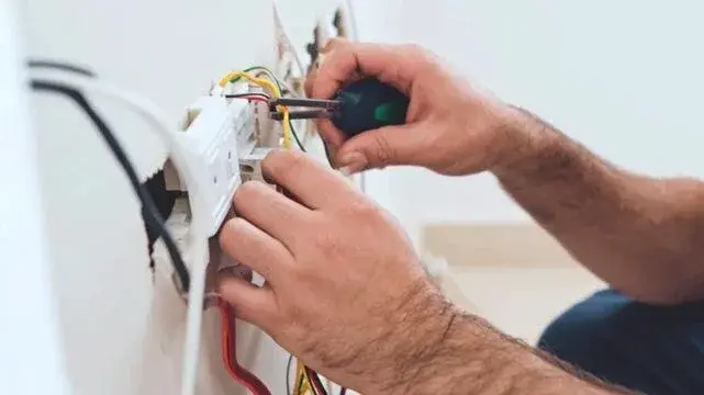 Electrician repairing a wiring connection during an electrical panel repair in Gastonia, NC Electrician repairing a wiring connection during an electrical panel repair in Gastonia, NC