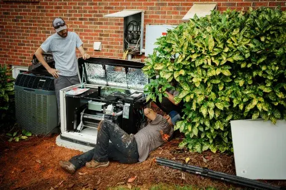 Roland Black technicians installing a standby generator at a brick home in Gastonia, NC Roland Black technicians installing a standby generator at a brick home in Gastonia, NC